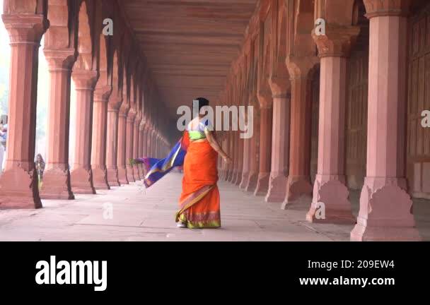 Woman Tourist Walking In Front Of Taj Mahal Unesco World Heritage Site