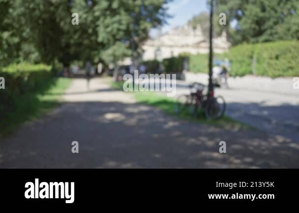 Blurry View Of People Walking In Villa Borghese Gardens In Rome On A