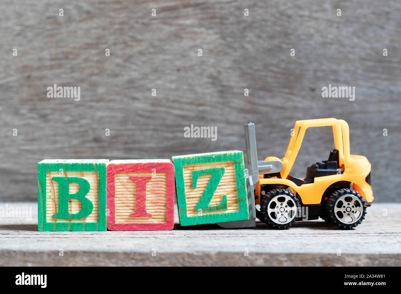 Toy Forklift Hold Letter Block Z To Complete Word Biz Abbreviation Of