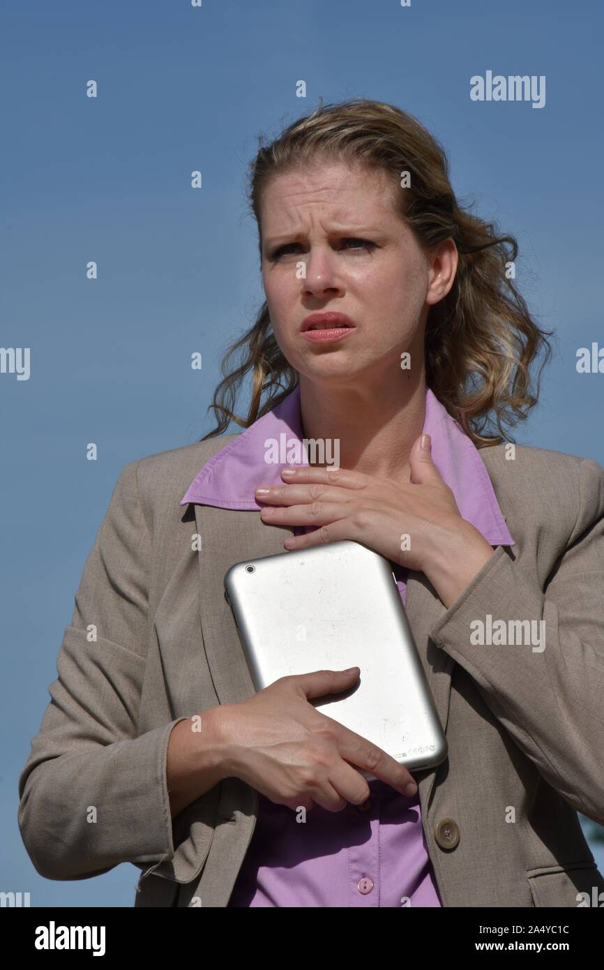 Adult Blonde Business Woman And Hope Wearing Suit With Tablet Stock