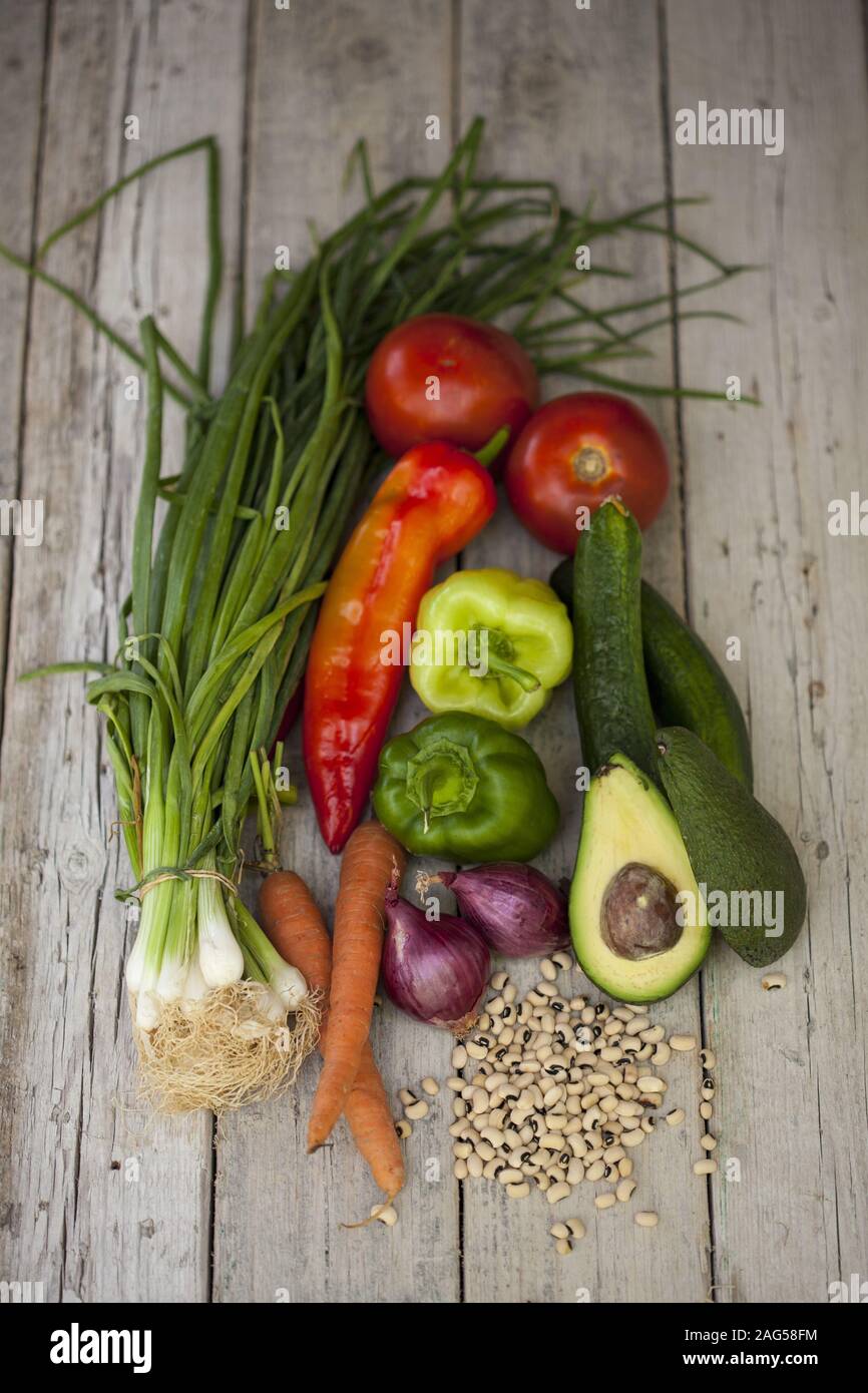 Vertical High Angle Shot Of Fresh Vegetables And Beans On A Wooden