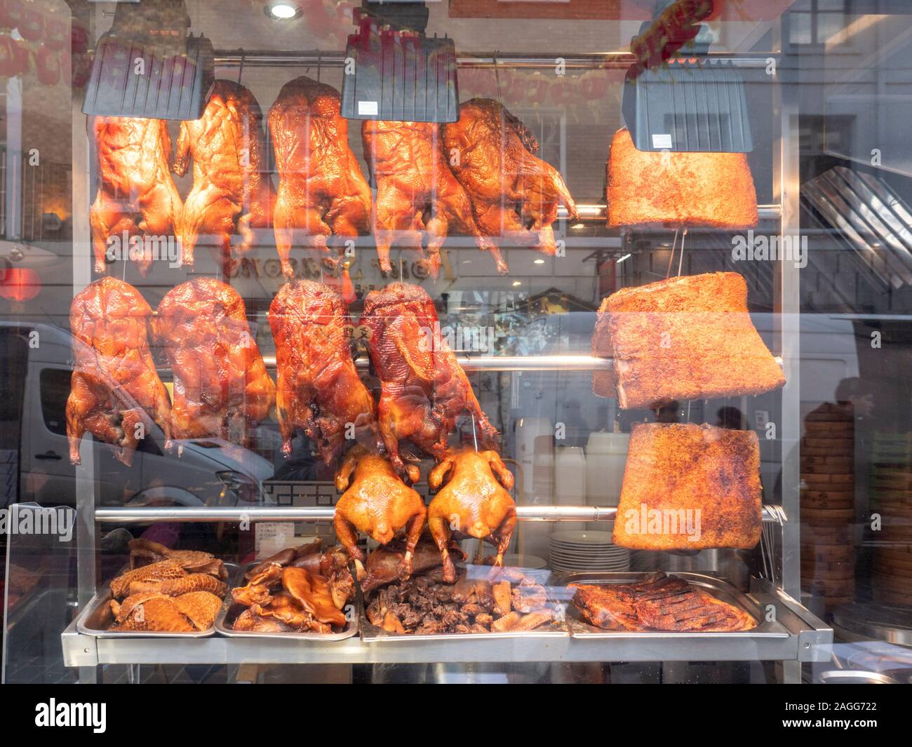 Peking Duck And Meats Haging In A Chinese Restaurant Window In Londons