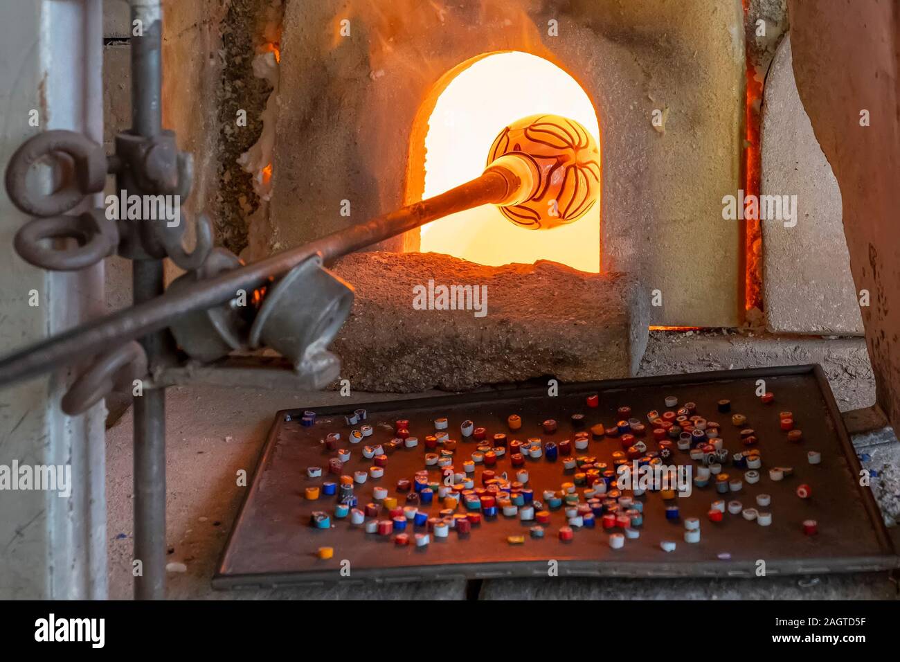 VENICE ITALY DECEMBER 03 Employees Work With Molten Glass In The