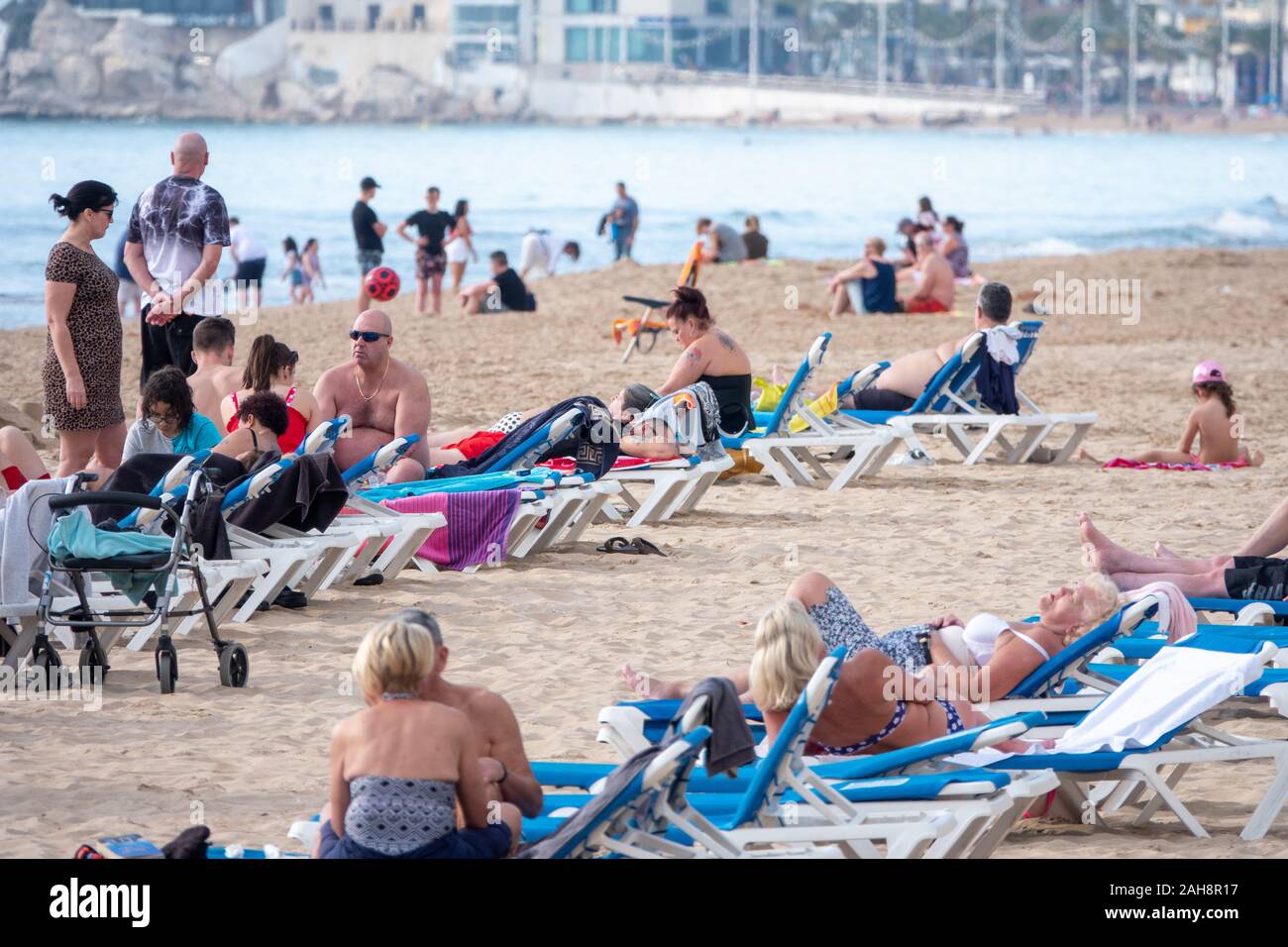 British Tourists Sunbathing On Levante Beach Benidorm Spain Stock