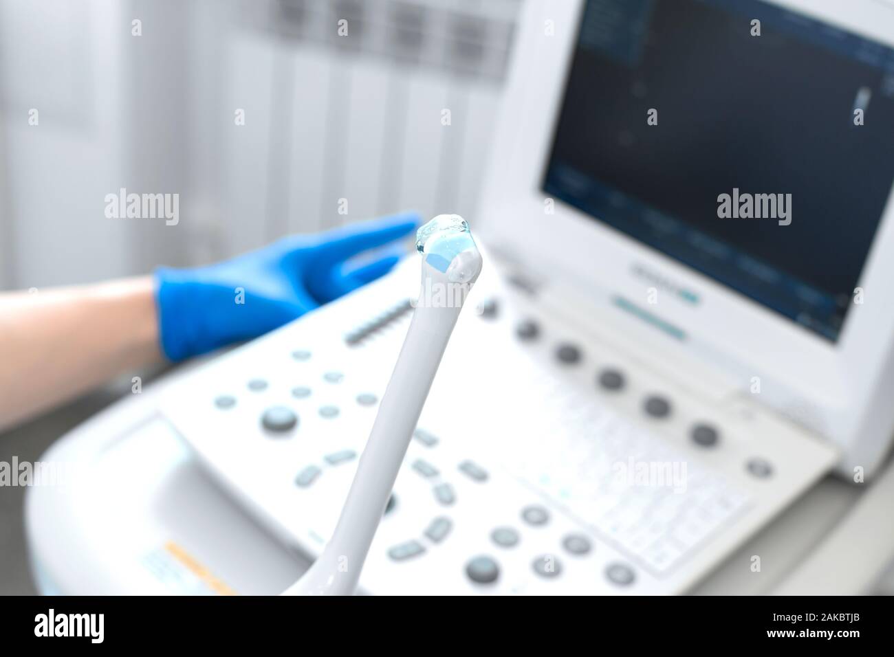 Gynecologist Doctor Prepares An Ultrasound Machine For The Diagnosis Of