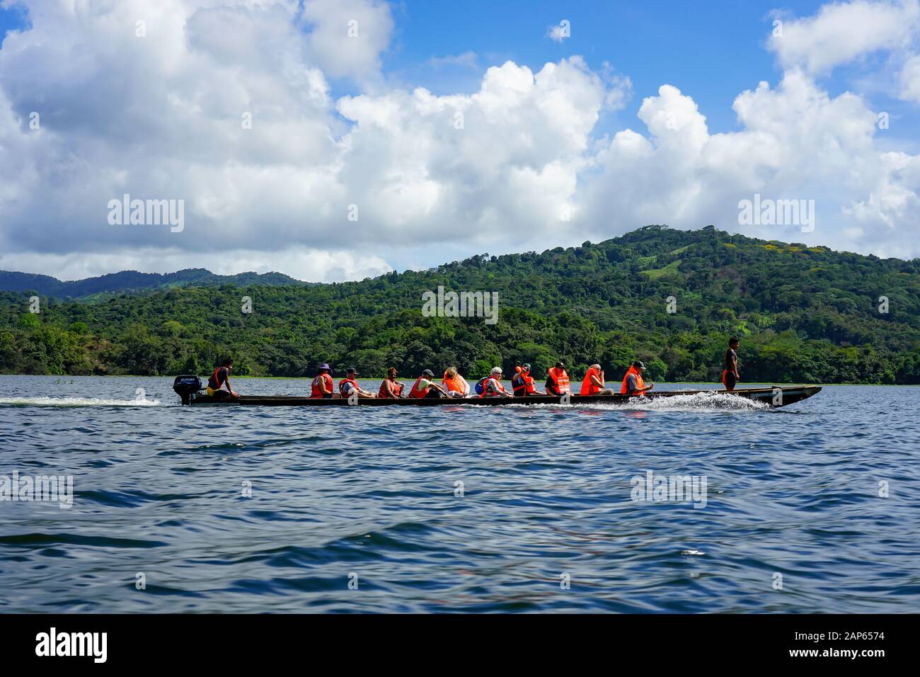 Tourist In Dugout Canoe Arriving At The Village Embera Puru Village In