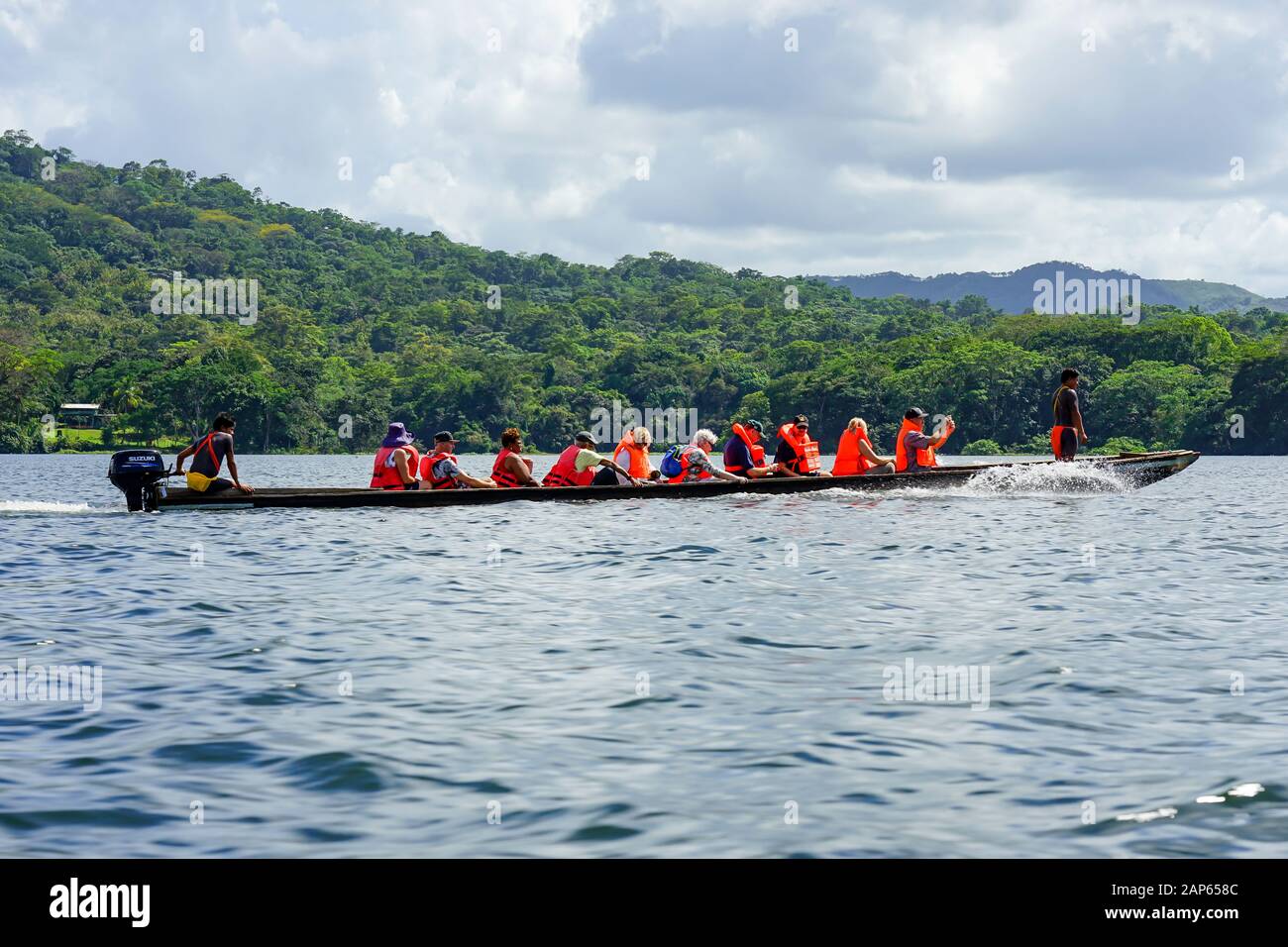 Tourist In Dugout Canoe Arriving At The Village Embera Puru Village In