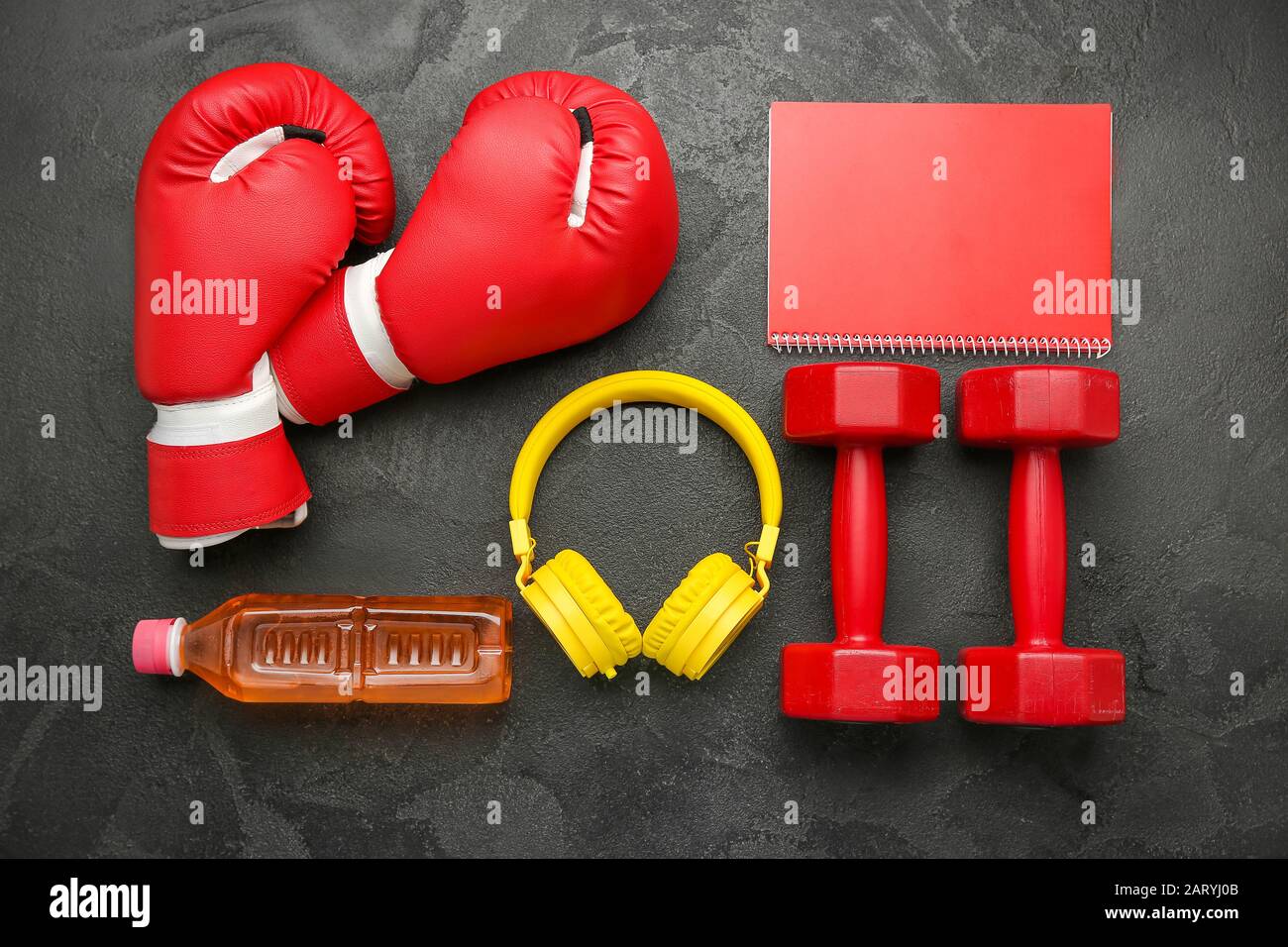 Dumbbells With Notebook Boxing Gloves Headphones And Bottle Of Water