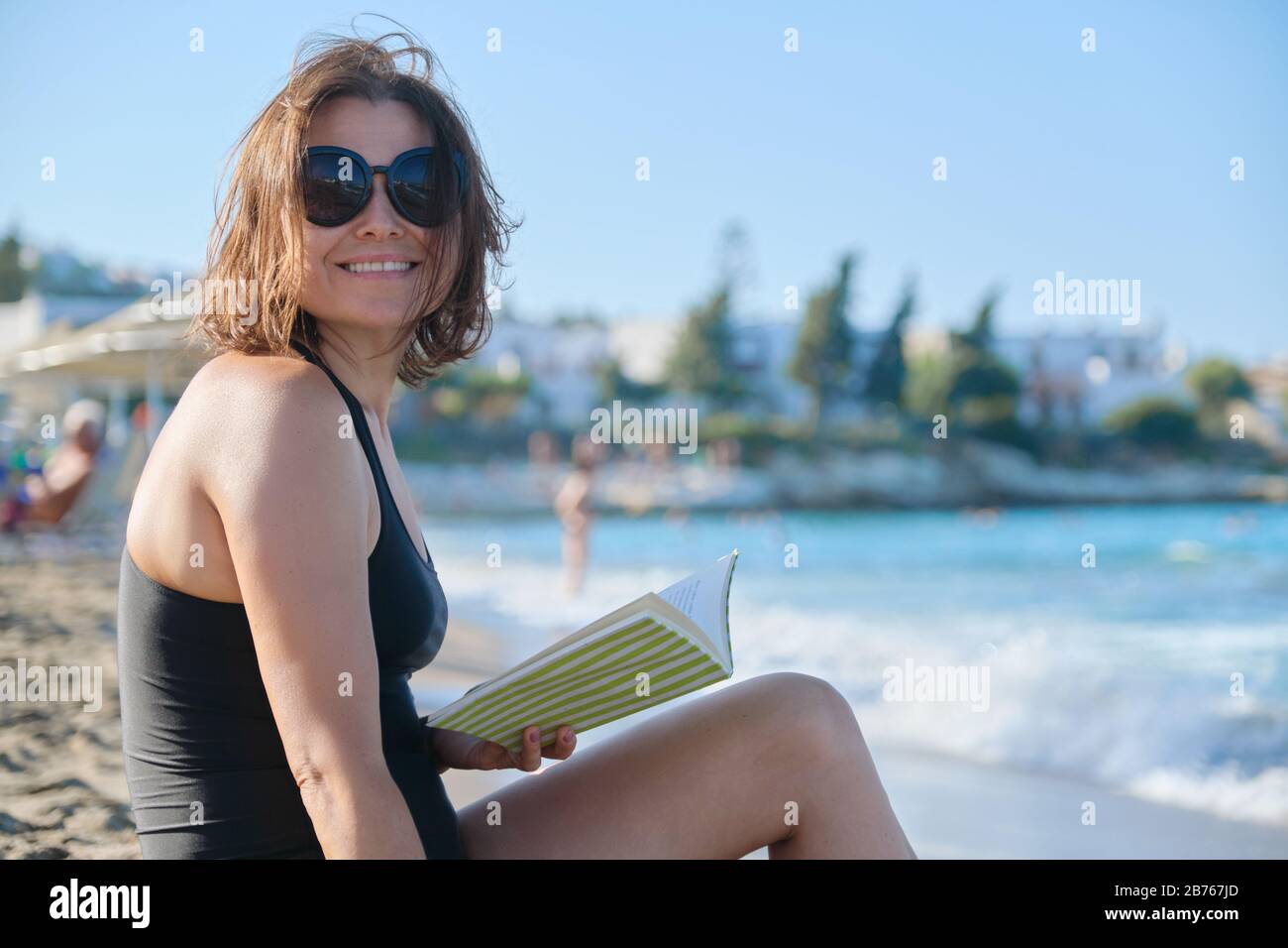 Mature Woman Relaxing Reading Book Enjoying Sea Sunset Stock Photo Alamy