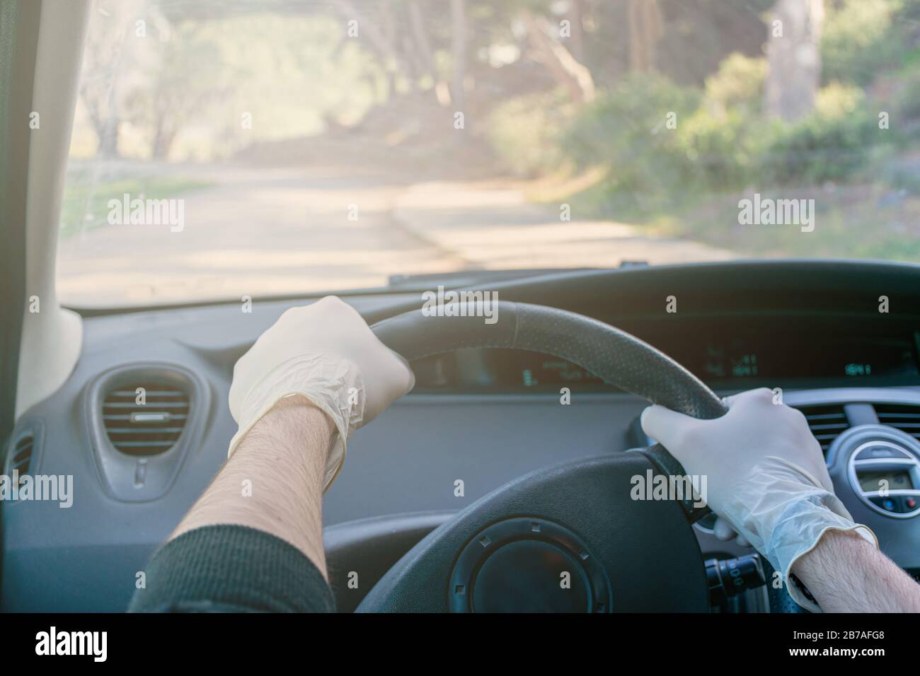 Hands Holding The Steering Wheel Of A Car While Driving With Latex