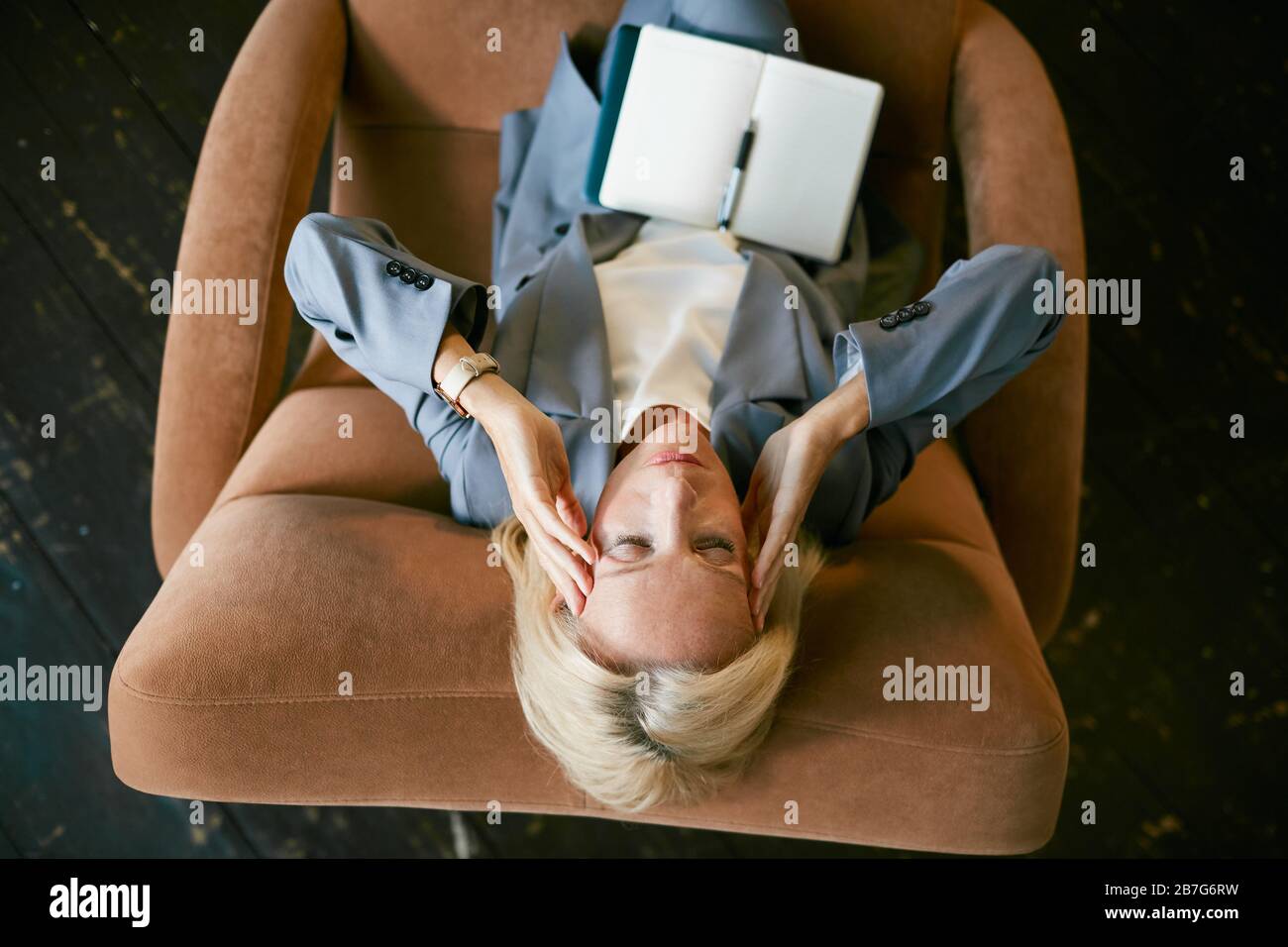 Top View Portrait Of Stressed Mature Businesswoman Rubbing Temples