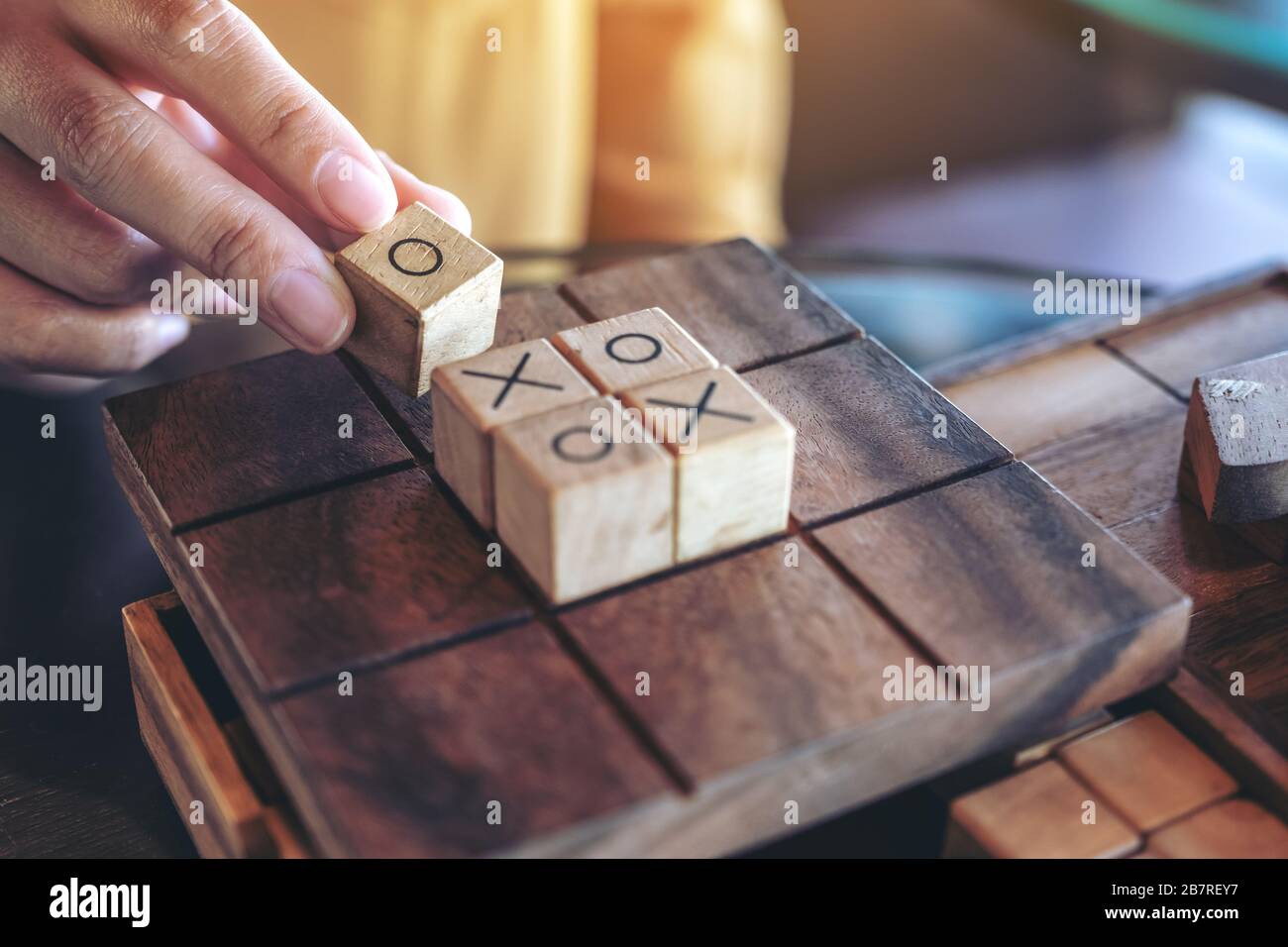 Closeup Image Of People Playing Wooden Tic Tac Toe Game Or Ox Game