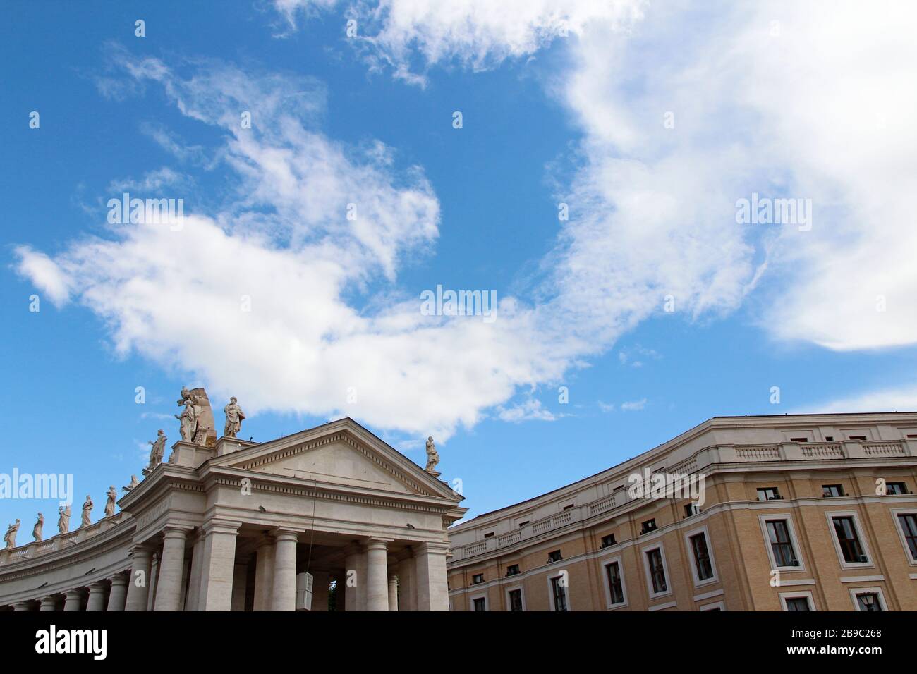 A Group Of Saint Statues On The Colonnades Of St Peter S Square With