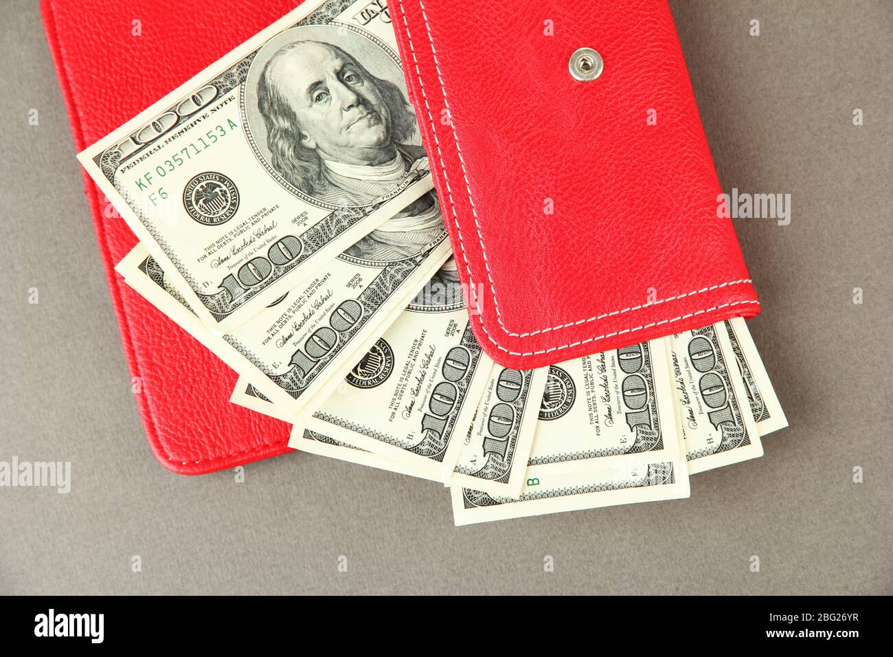 Purse With Hundred Dollar Banknotes On Color Background Stock Photo