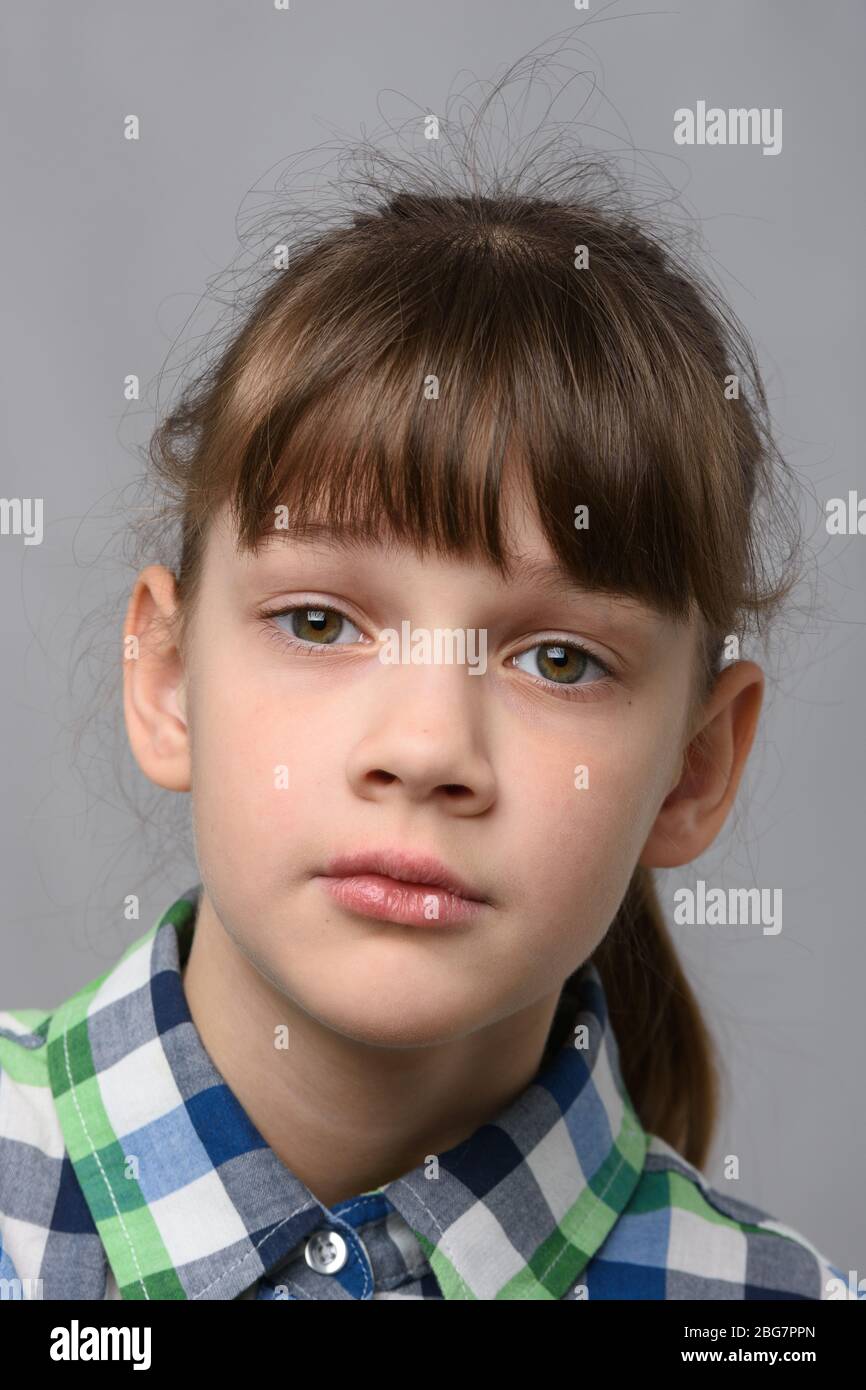 Portrait Of A Compassionate Ten Year Old Girl Of European Appearance