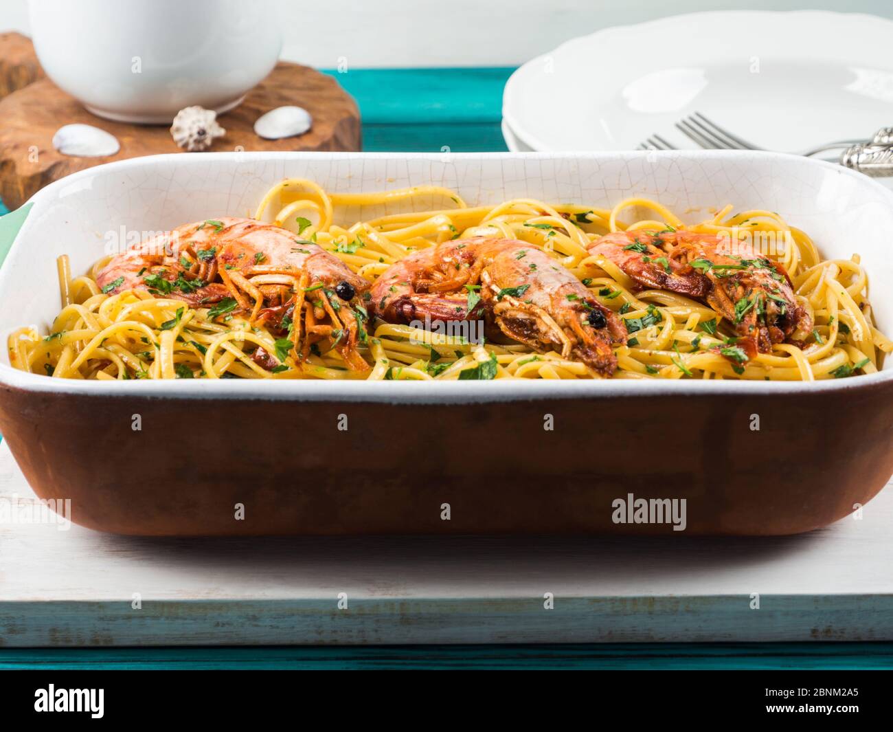 Linguine Pasta With Tiger Prawn Sauce In White Dish Stock Photo Alamy