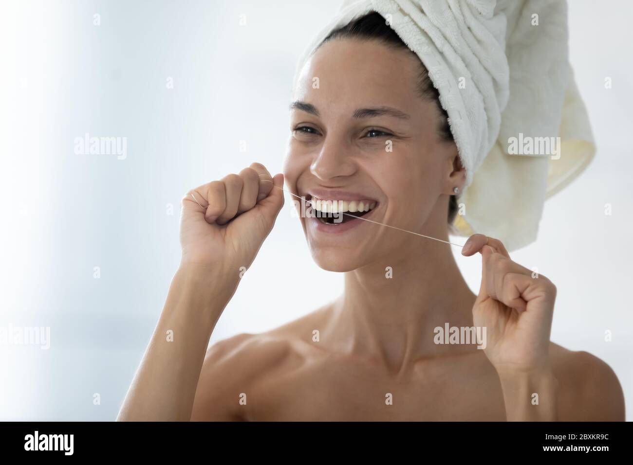 Head Shot Smiling Beautiful Woman Holding Dental Floss Cleaning Teeth