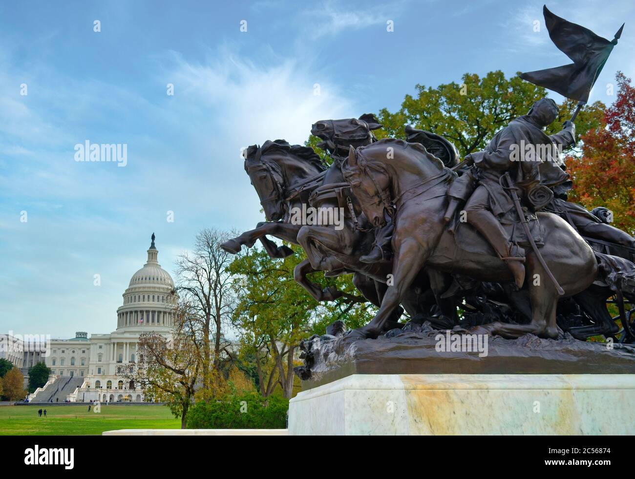 The U S Capitol Building Is Seen Behind Large Bronze Sculptures Of The