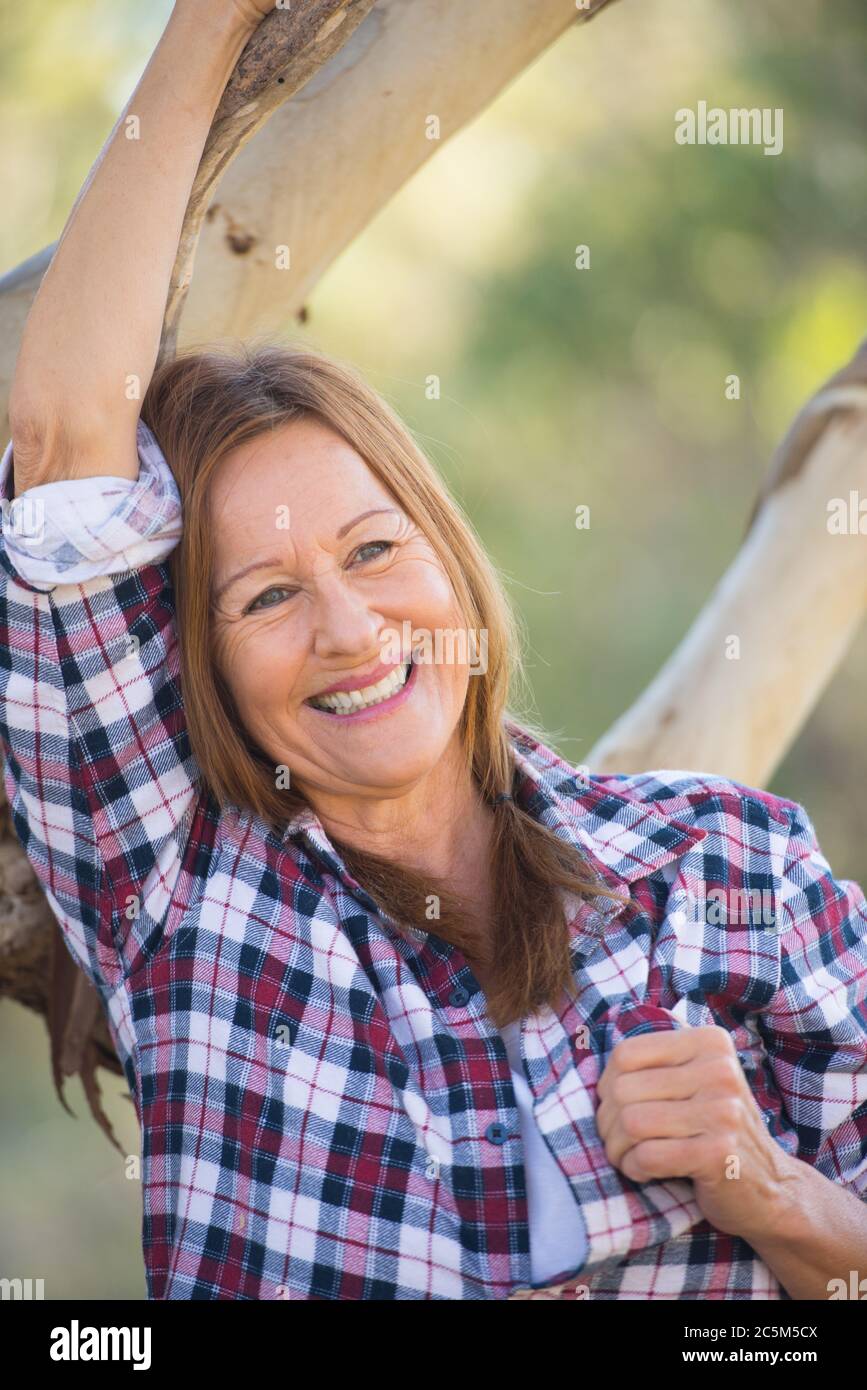 Portrait Attractive Mature Woman In Rural Country Wearing Plaid Shirt