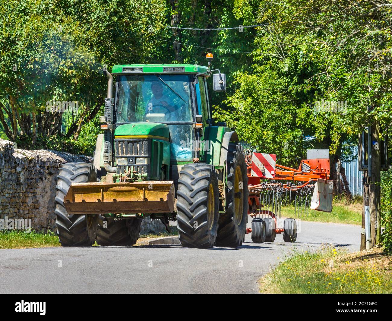 John Deere Tractor On Country Road France Stock Photo