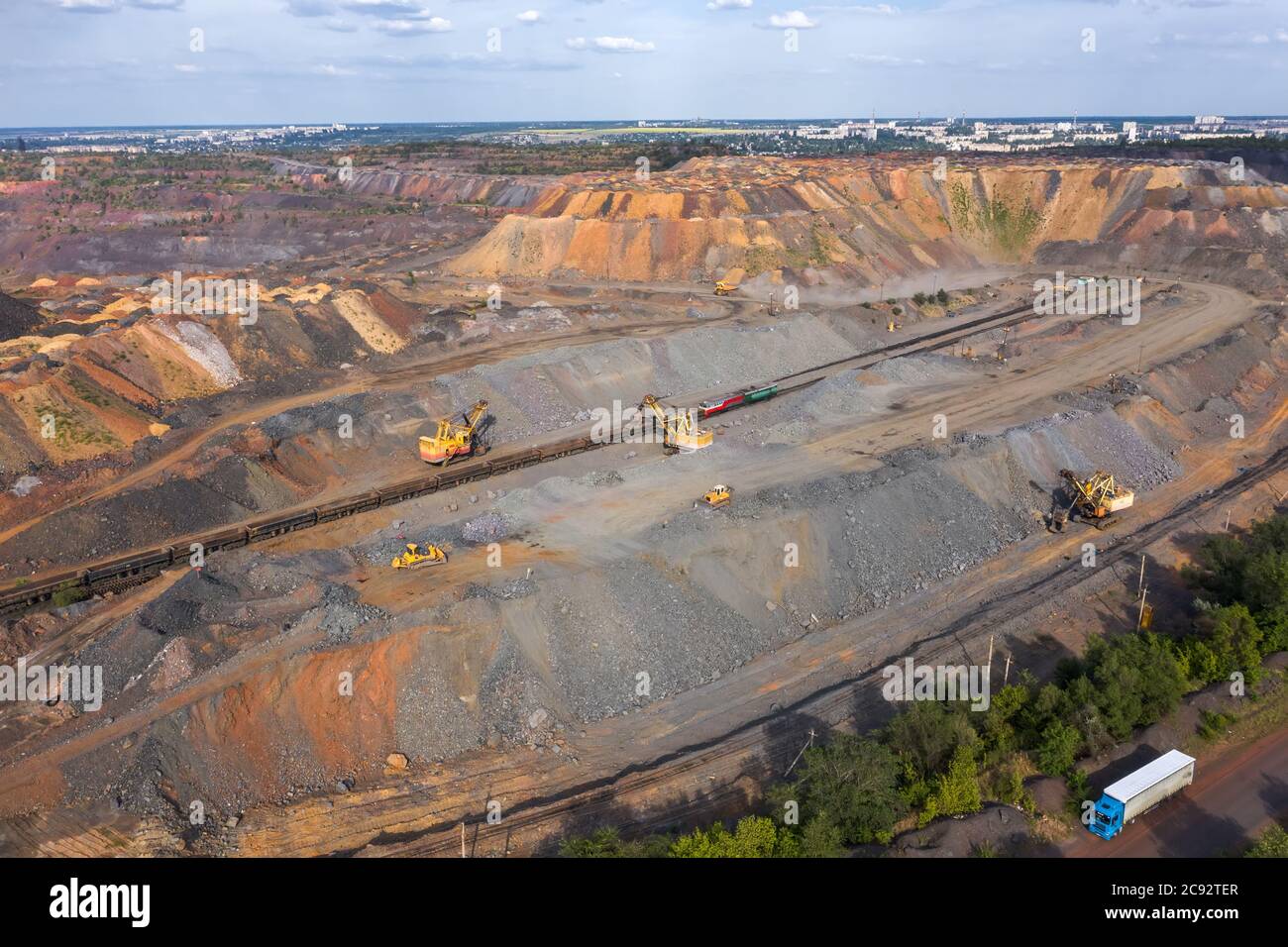 Industrial Of Opencast Mining Quarry With Lots Of Machinery At Work