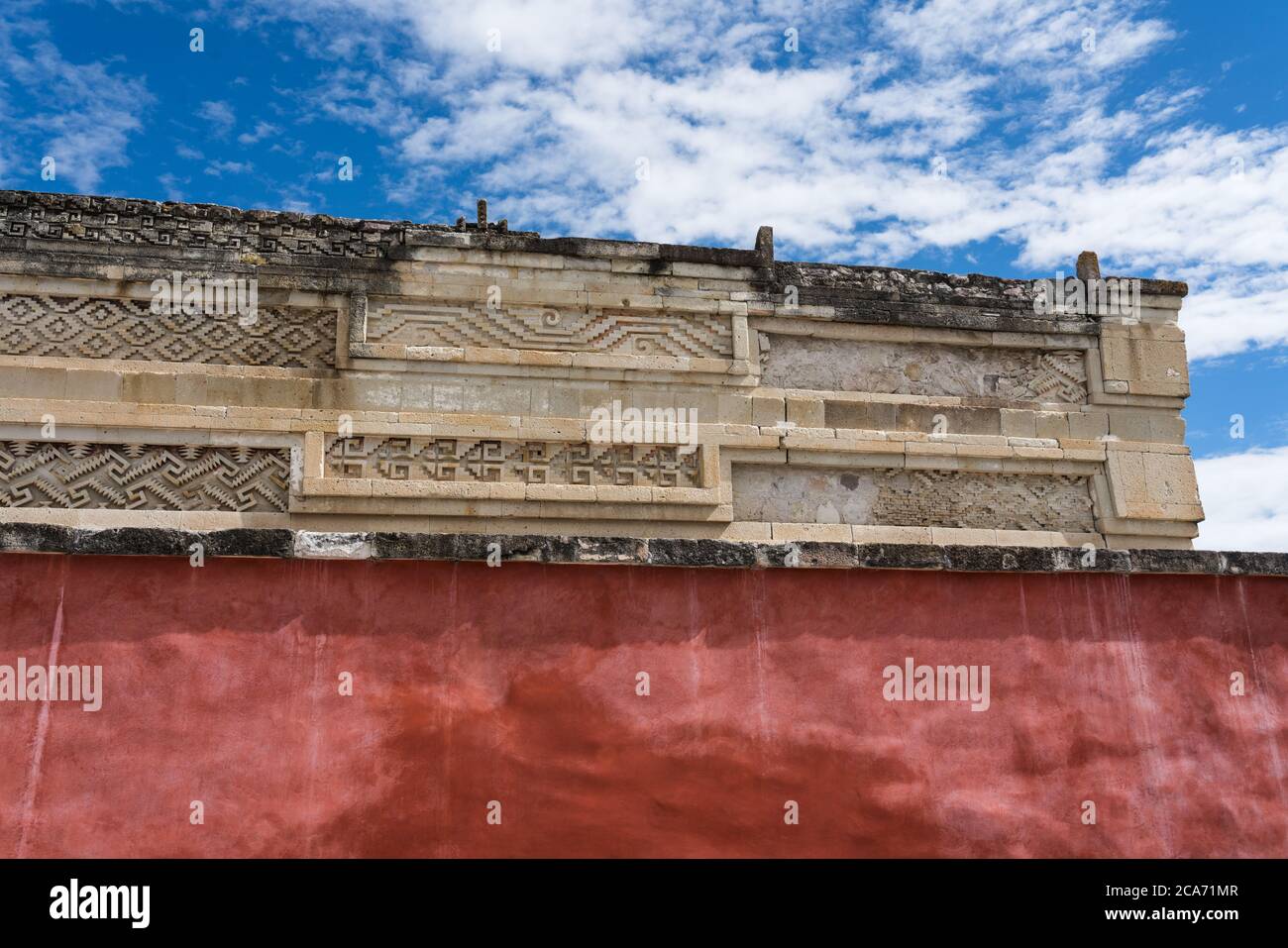 Stone Fretwork Panels And Red Stucco On The Front Of The Palace