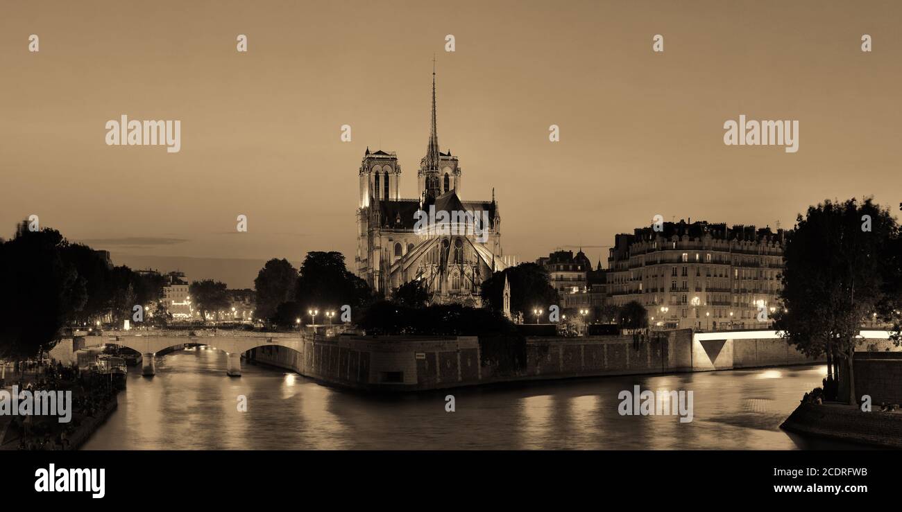 Notre Dame De Paris At Dusk Panorama Over River Seine As The Famous