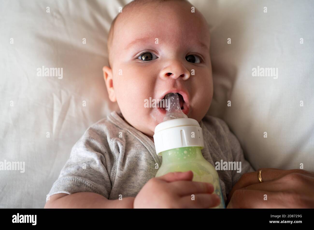 Baby Drinking Milk From Bottle Stock Photo Alamy