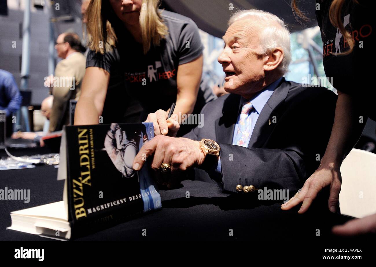 Apollo Astronaut Buzz Aldrin Signs His Book Magnificent Desolation