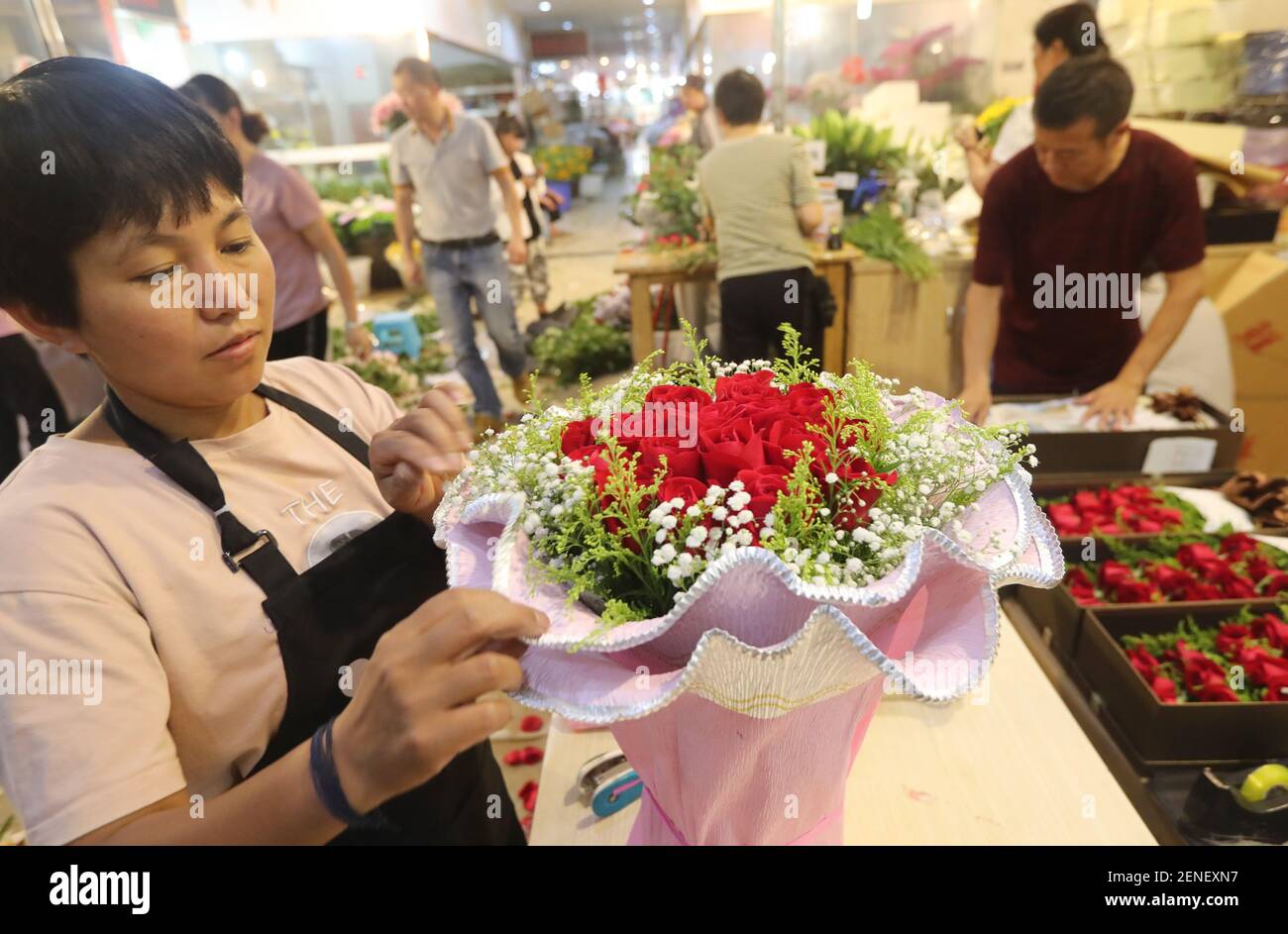 Chinese Workers Display Flowers At A Flower Market Ahead Of Traditional