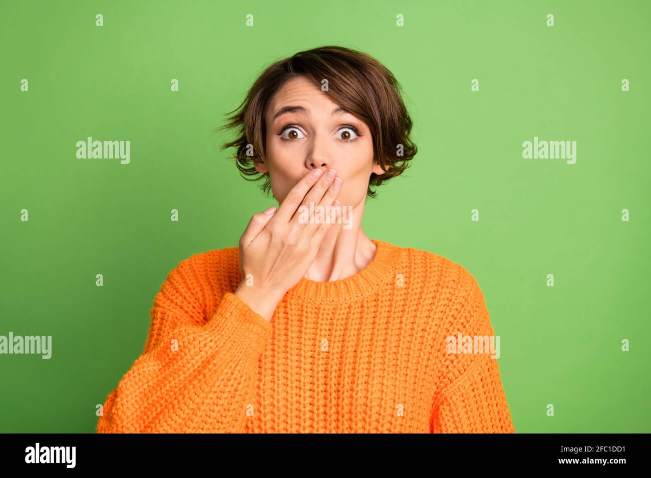 Portrait Of Optimistic Nice Brunette Lady Blow Kiss Wear Orange Sweater