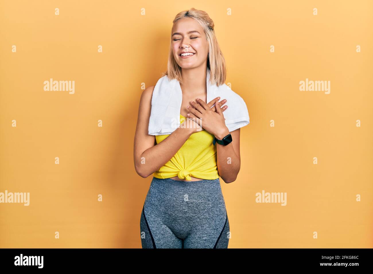 Beautiful Blonde Sports Woman Wearing Workout Outfit Smiling With Hands