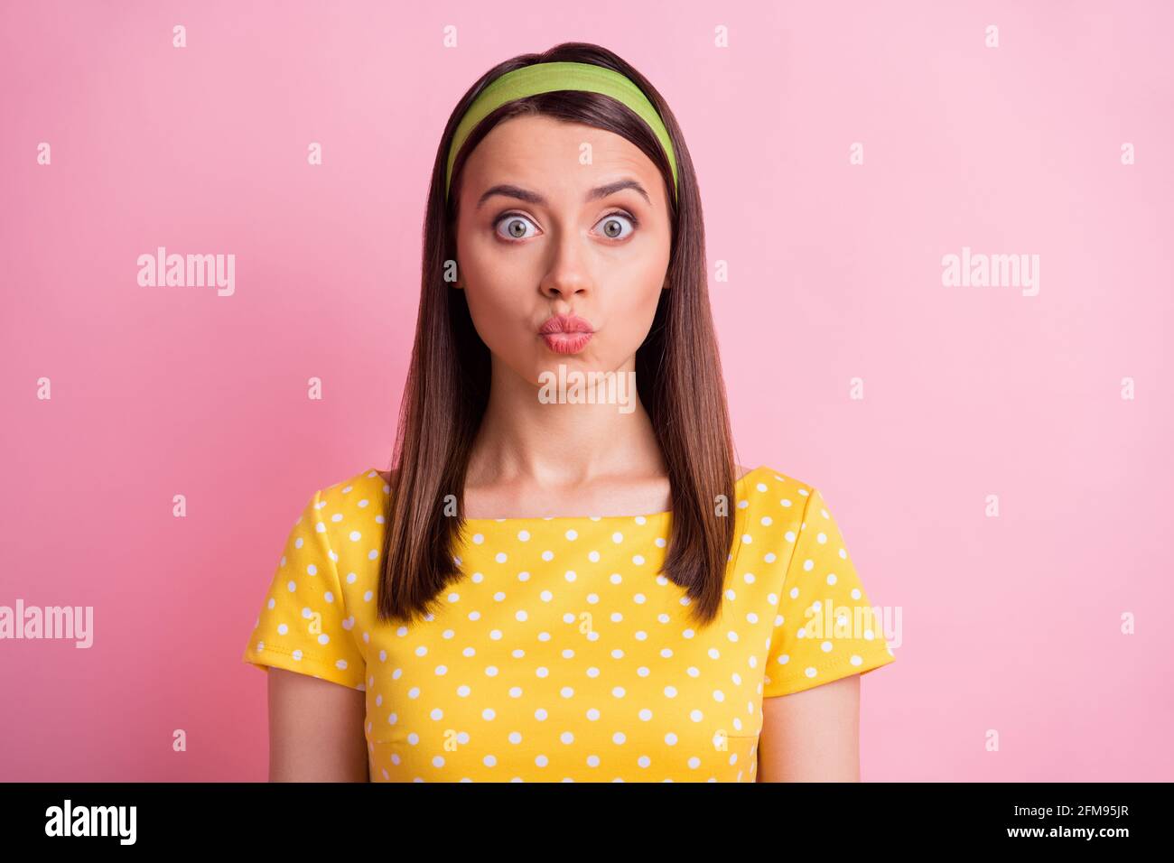 Portrait Of Impressed Pretty Brunette Girl Blow Kiss Wear Yellow Cloth