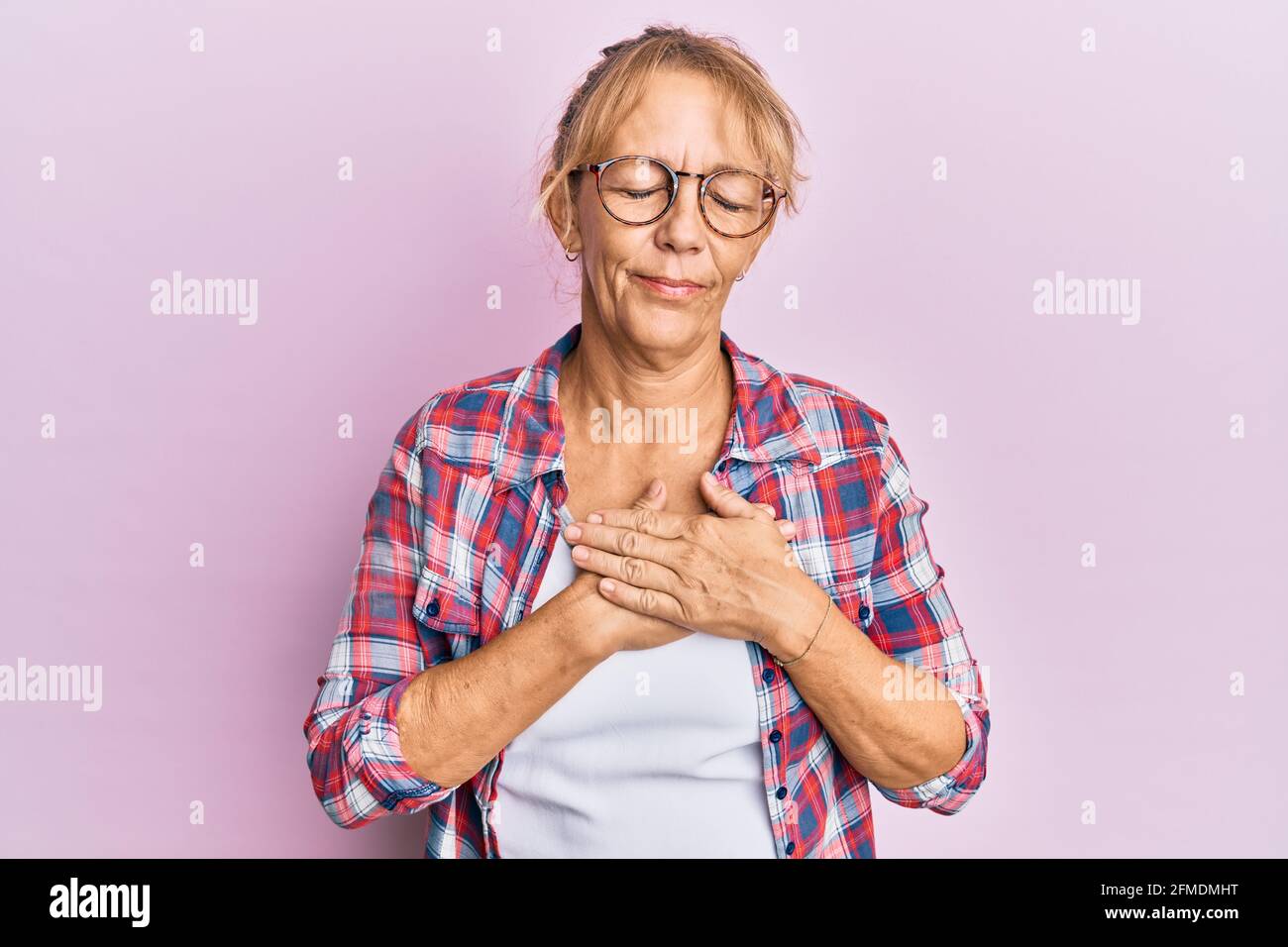 Middle Age Blonde Woman Wearing Casual Clothes And Glasses Smiling With