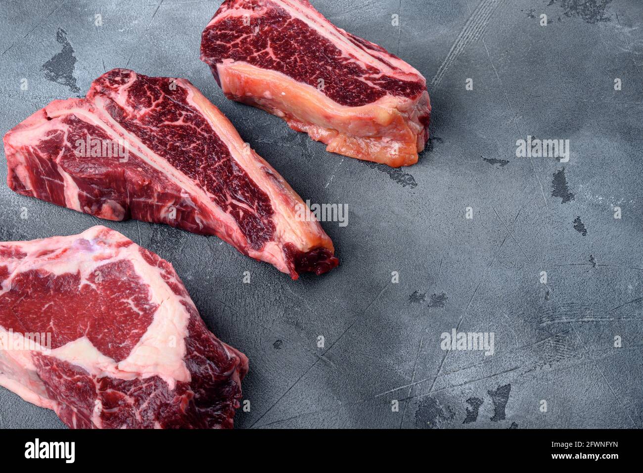 Variety Of Raw Black Angus Prime Dry Aged Meat Steaks Set Tomahawk T