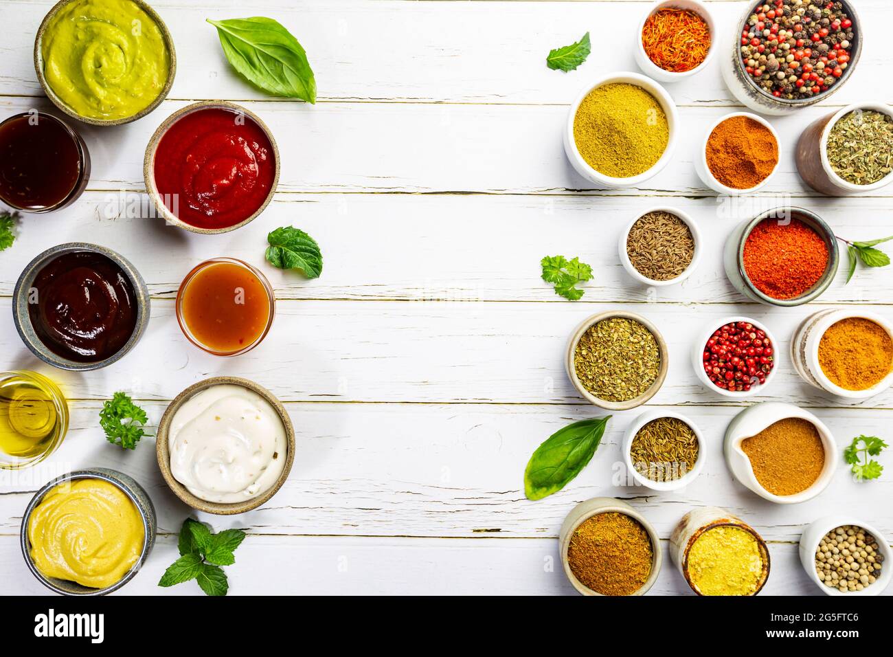 Set Of Different Bowls Of Various Dip Sauces On White Background Top