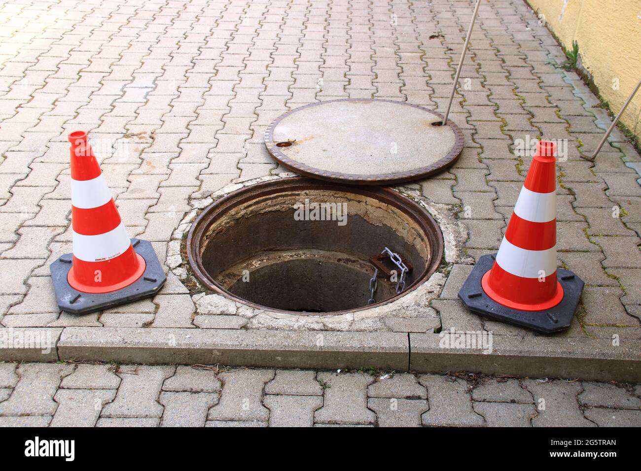 Open Manhole Is Secured With Traffic Cones Stock Photo Alamy