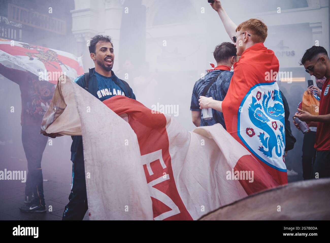 London Uk English Fans Waving Flags At Leicester Square