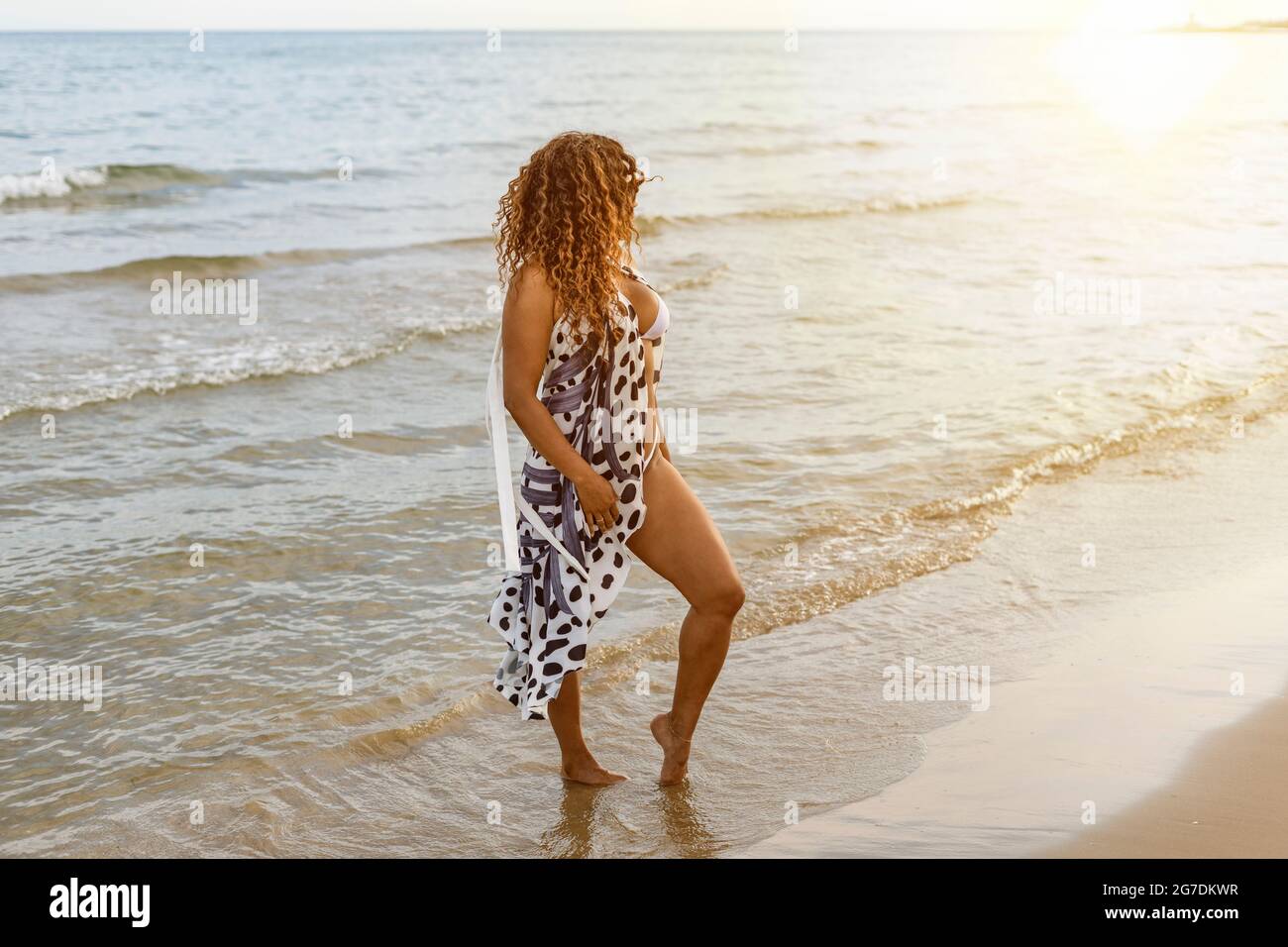 Portrait Of Stylish Afro Latin Model In Bikini And Pareo At Sunset On