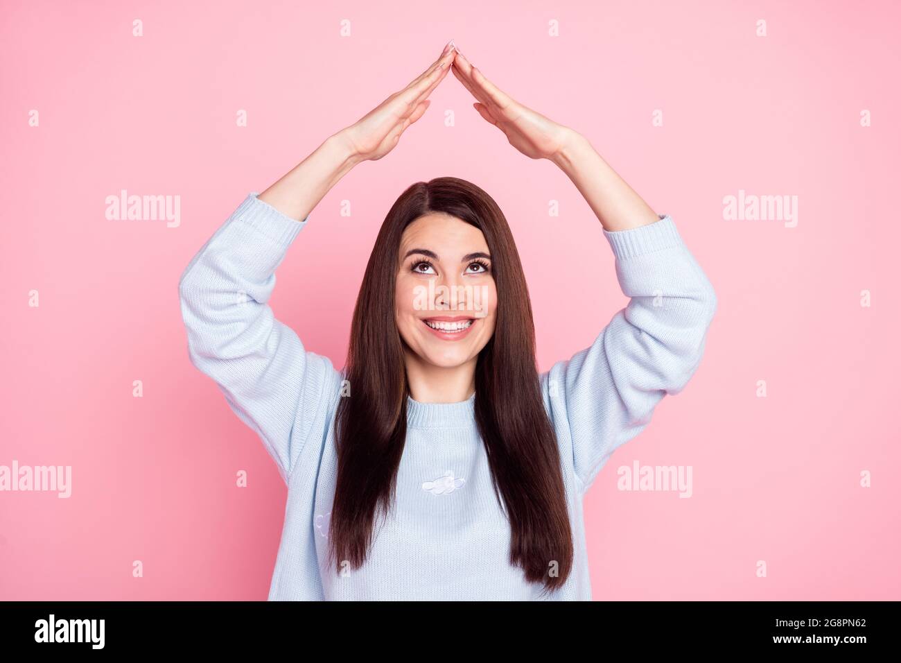 Photo Of Nice Optimistic Long Hairdo Brunette Lady Show Roof Wear Blue