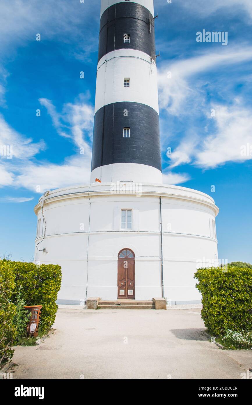 The Chassiron Lighthouse With Black And White Stripes On Blue Sky On