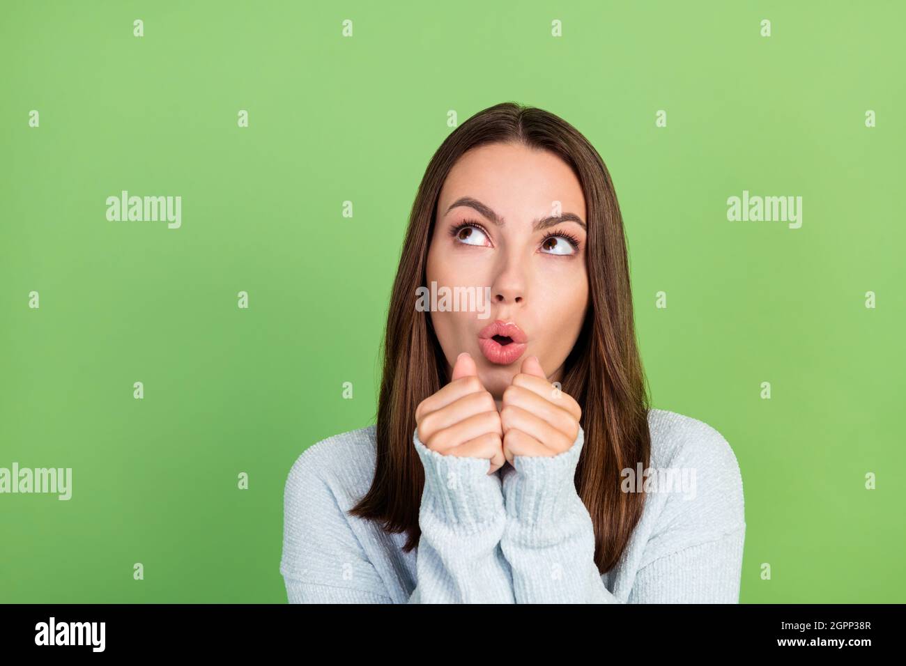 Photo Of Impressed Millennial Brunette Lady Fists Face Look Wear Jumper