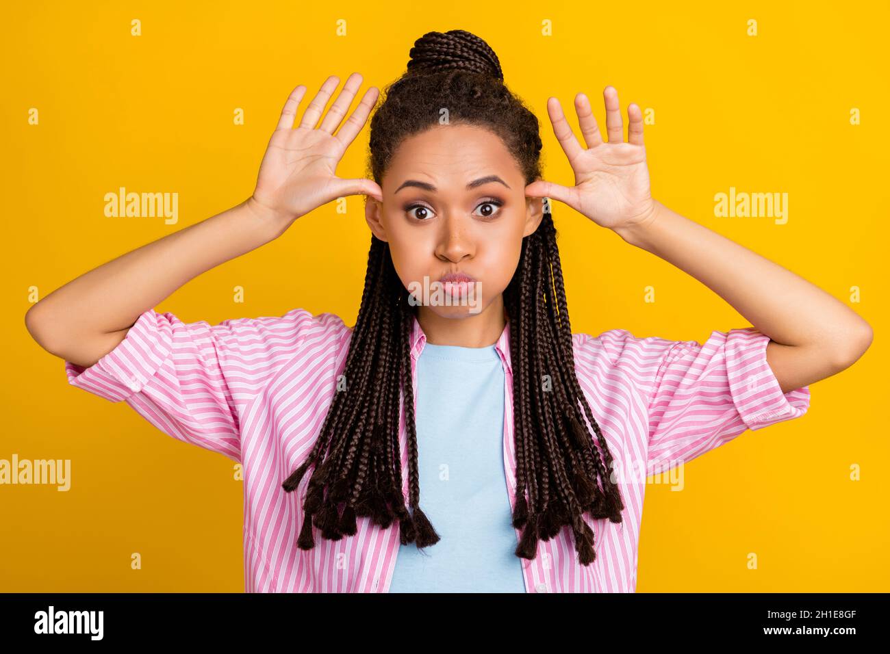 Photo Of African Funky Lady Palms Head Inflate Cheeks Mock Wear Striped