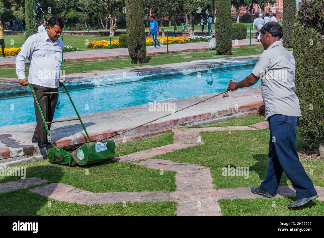 AGRA INDIA FEBRUARY 19 2017 Local Gardeners Mowe A Lawn On Grounds