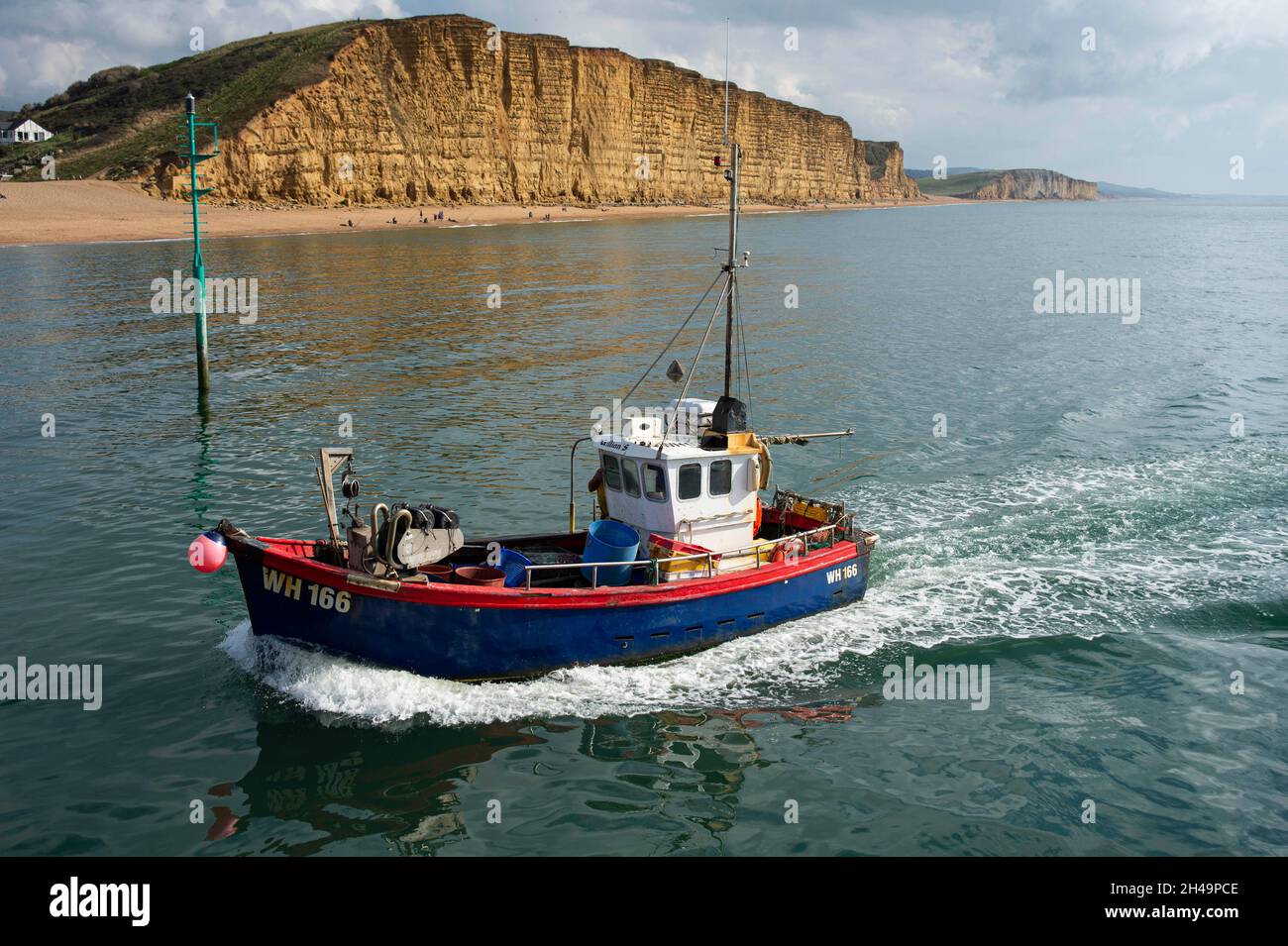 Fishing Boats Entering The Harbour At West Bay Bridport Dorset