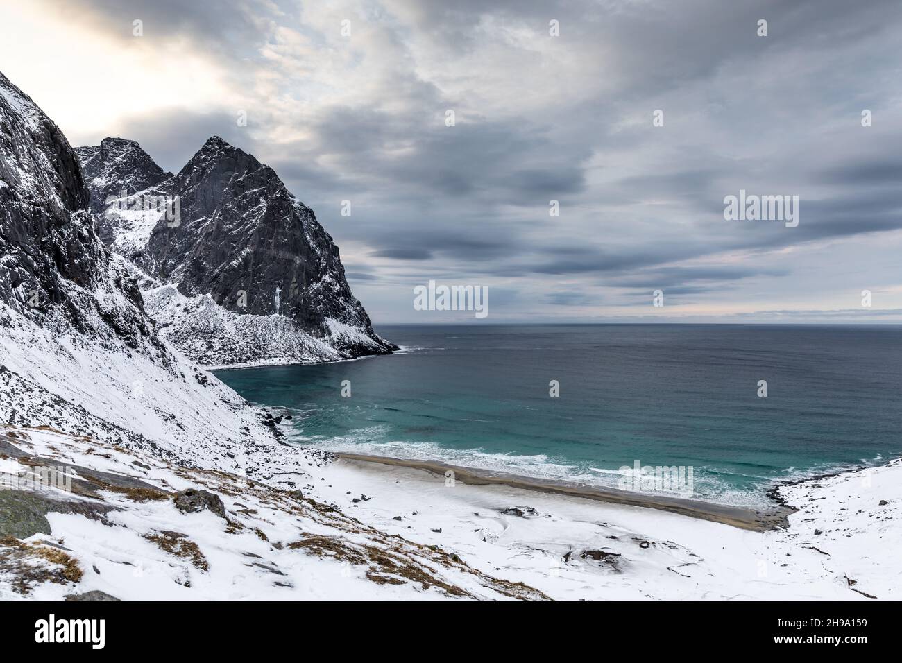 A Landscape Of The Kvalvika Beach Under A Cloudy Sky On A Rainy Day In