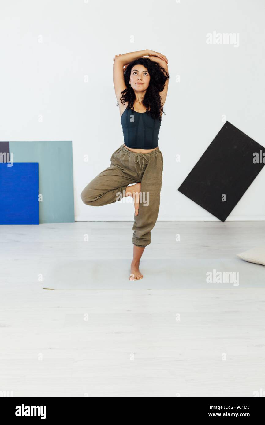 Woman Brunette Engaged In Yoga Asana Gymnastics Exercises One Stock