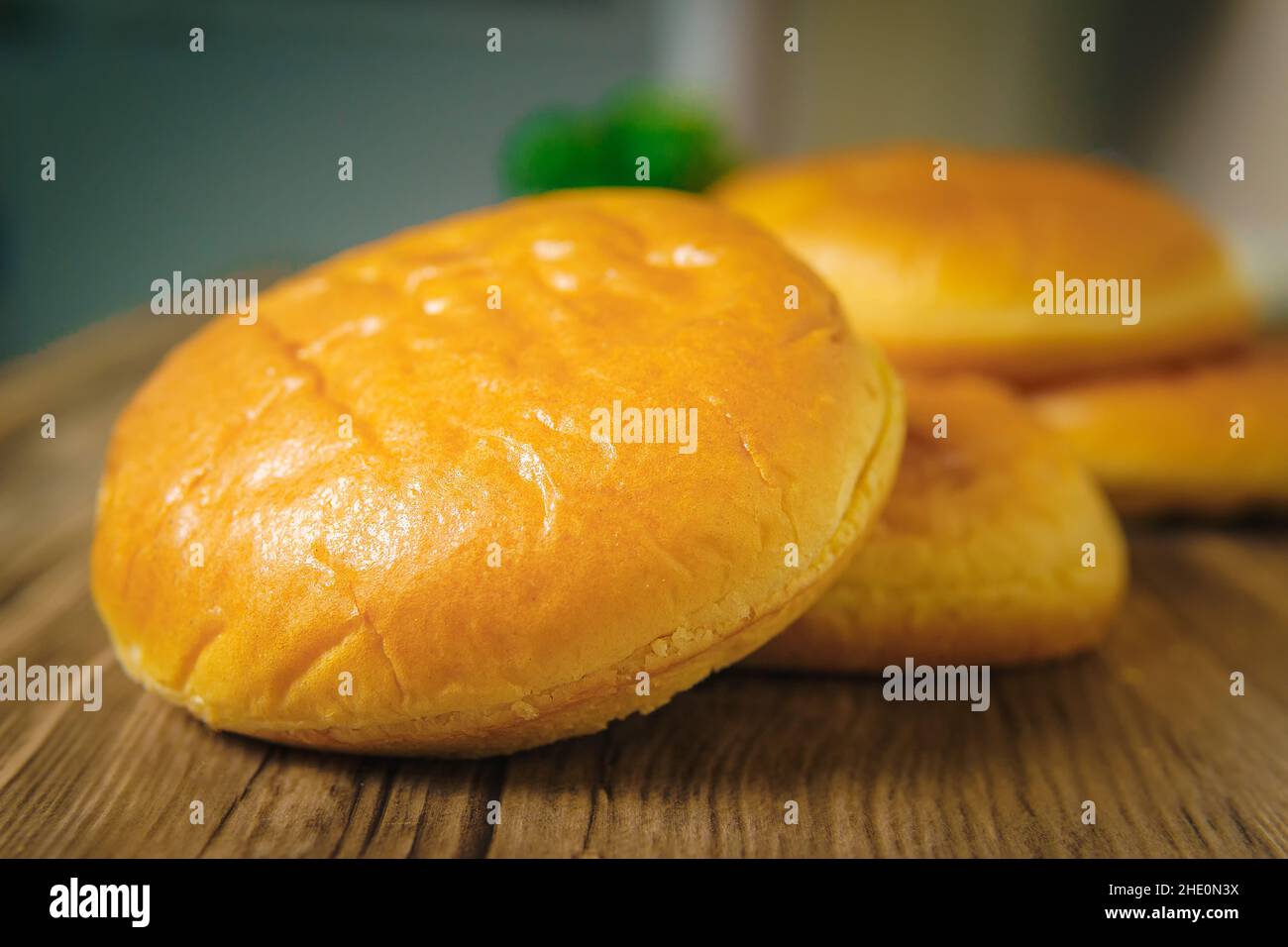 Two Hamburger Buns With Sesame Seeds Isolated In A Kitchen Empty