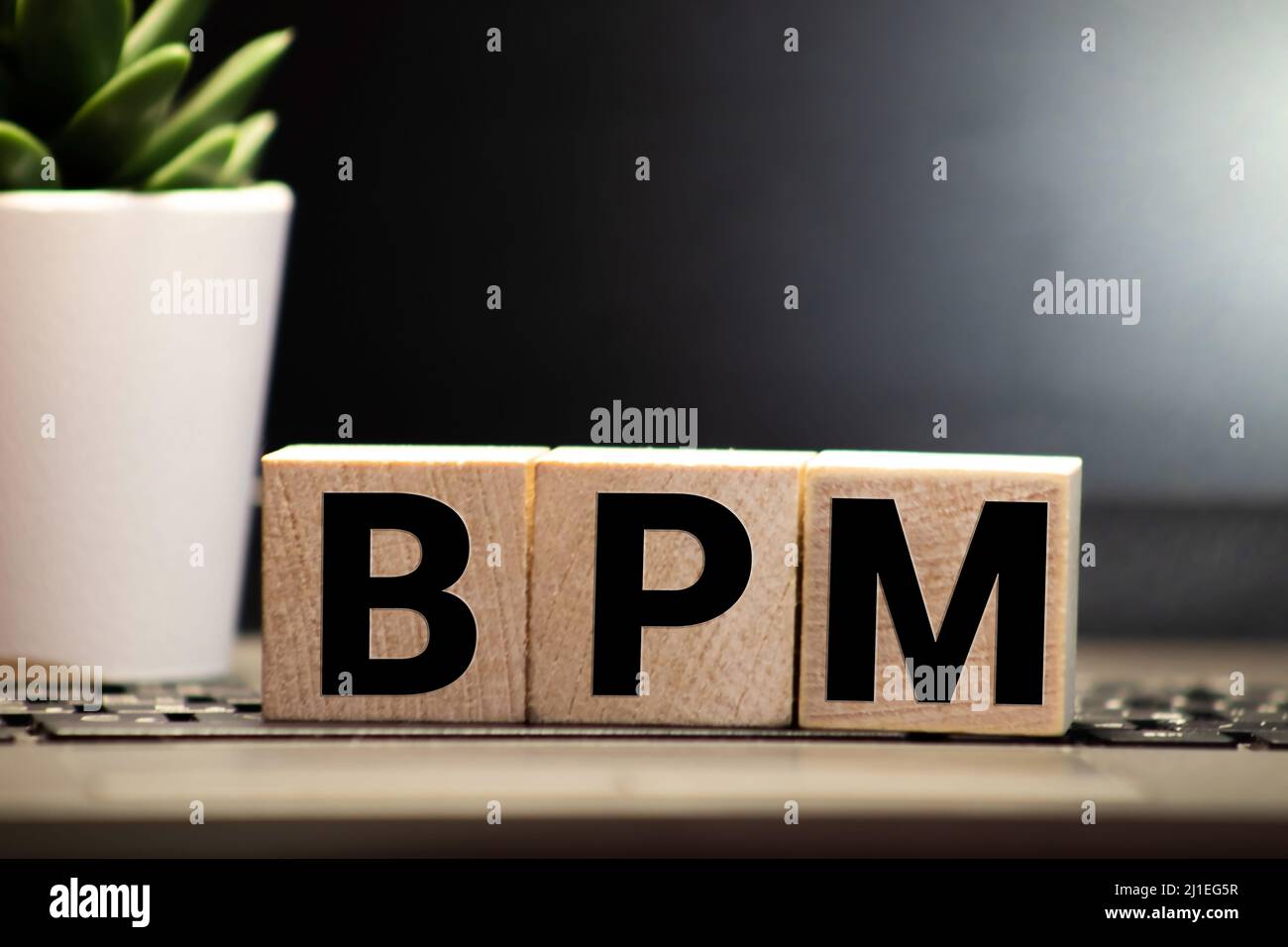 Bpm Business Process Management Written On A Wooden Cube In A Office