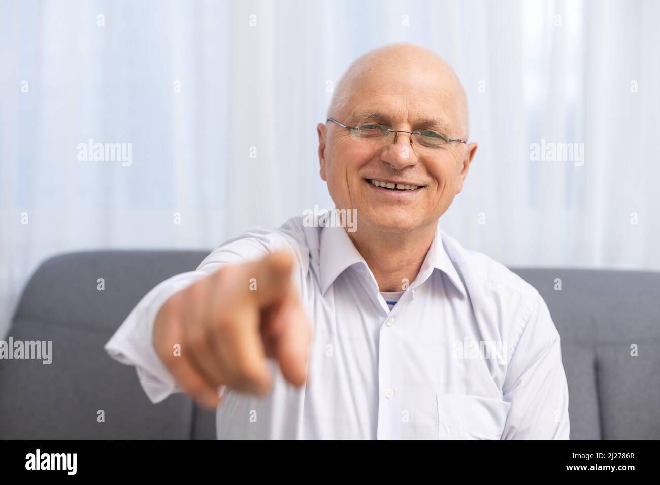 Mature Man Pointing With His Finger At You On Grey Background Stock